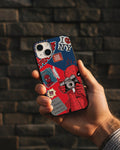 Hand holding a phone with a red and blue case against a dark brick wall.